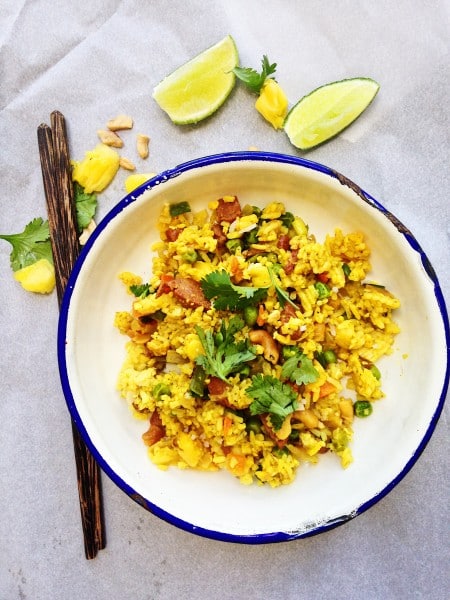 Thai Pineapple Fried Rice Recipe-Thai-Foodie: Love how all the flavors in Thai Pineapple fried rice go so perfectly together: pineapple, cashews, green onions, green peas, carrots, and tumeric! Easy, and yummy Thai fried rice weeknight dinner!