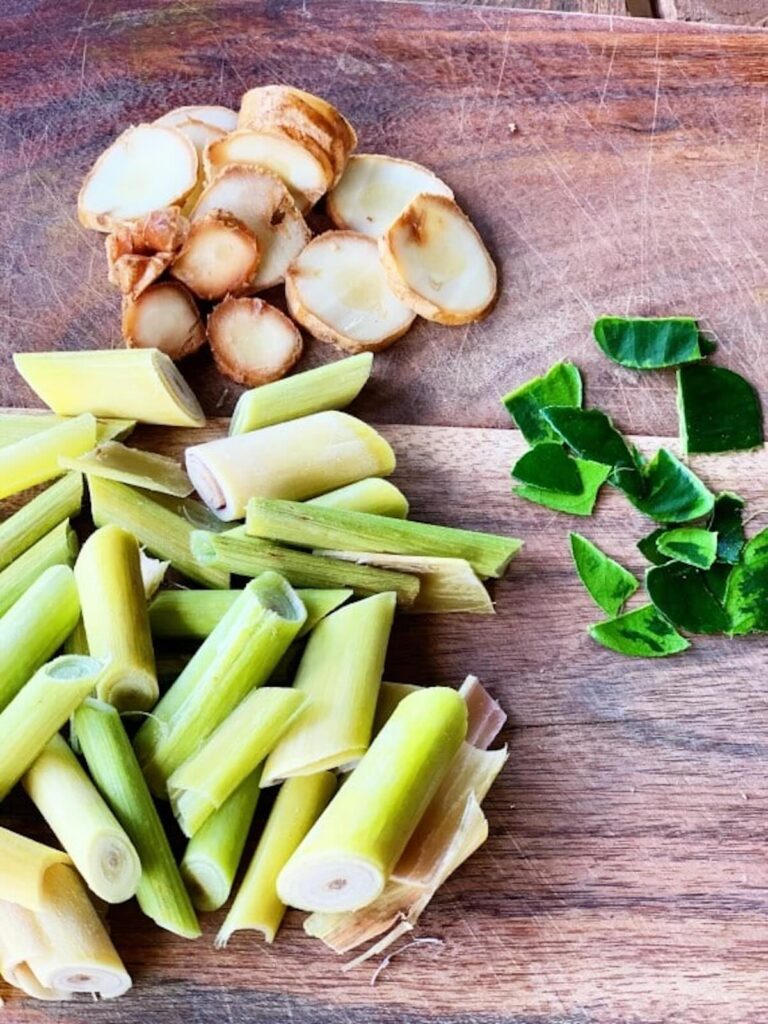 lemongrass, Kaffir Lime Leaves, galangal cut up.